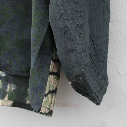 Syninger på ærme på langærmet silke skjorte fra Cofur