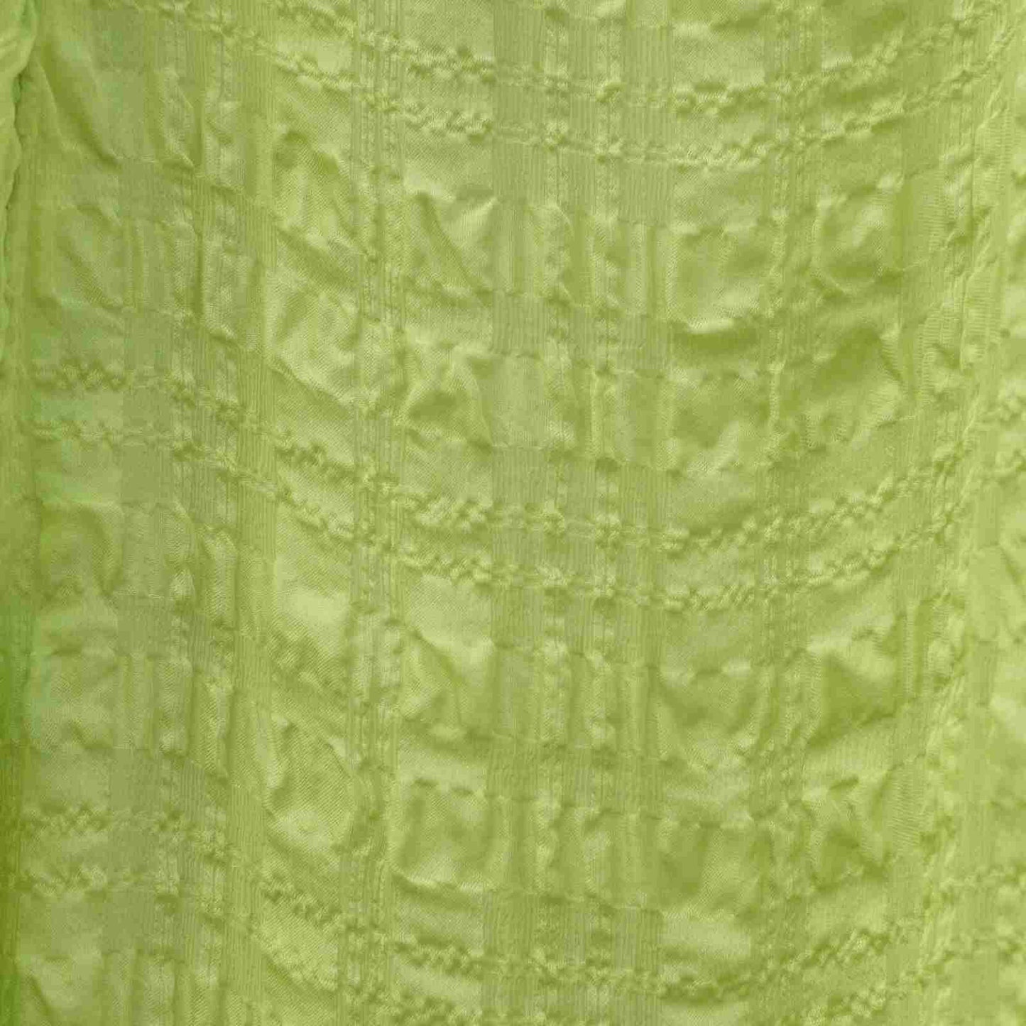Stof detalje af limegrøn silkekjole
